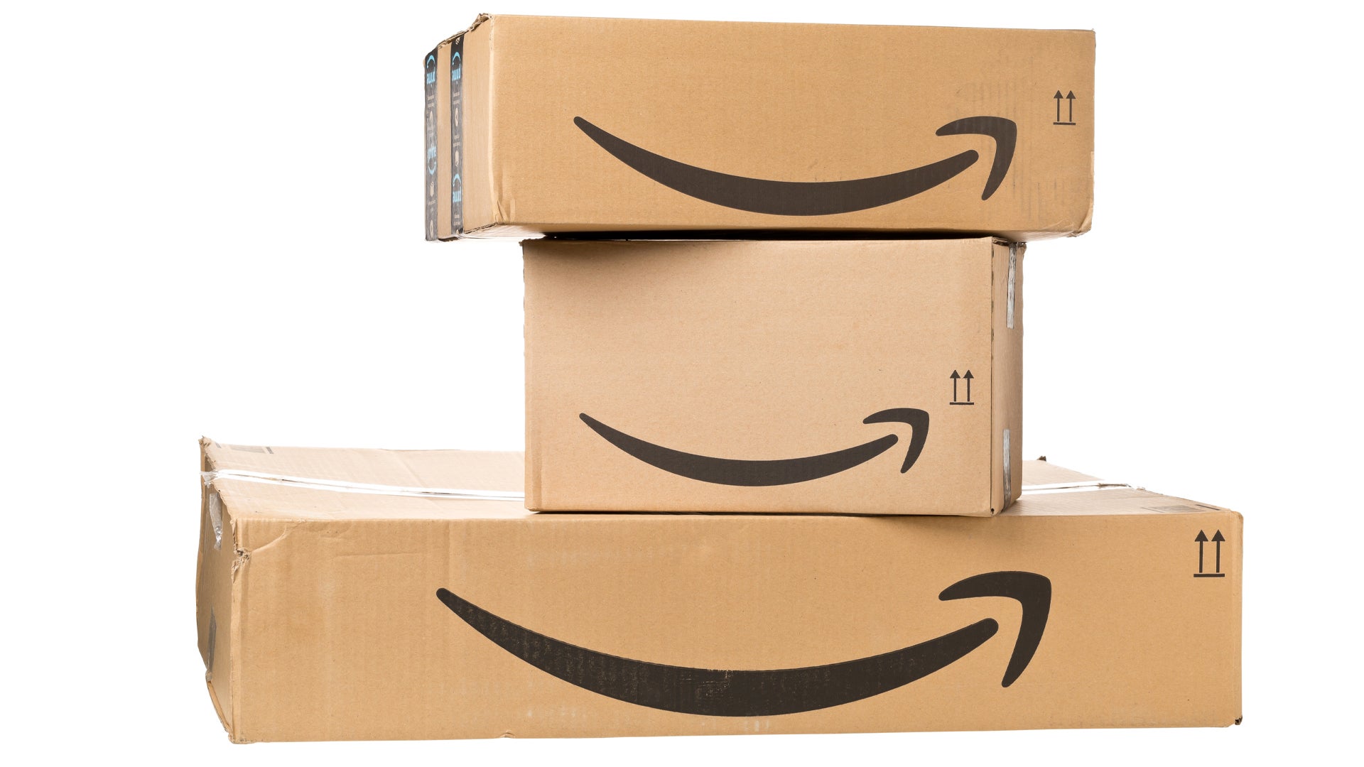 A stacked pile of three Amazon boxes showing the Amazon logo