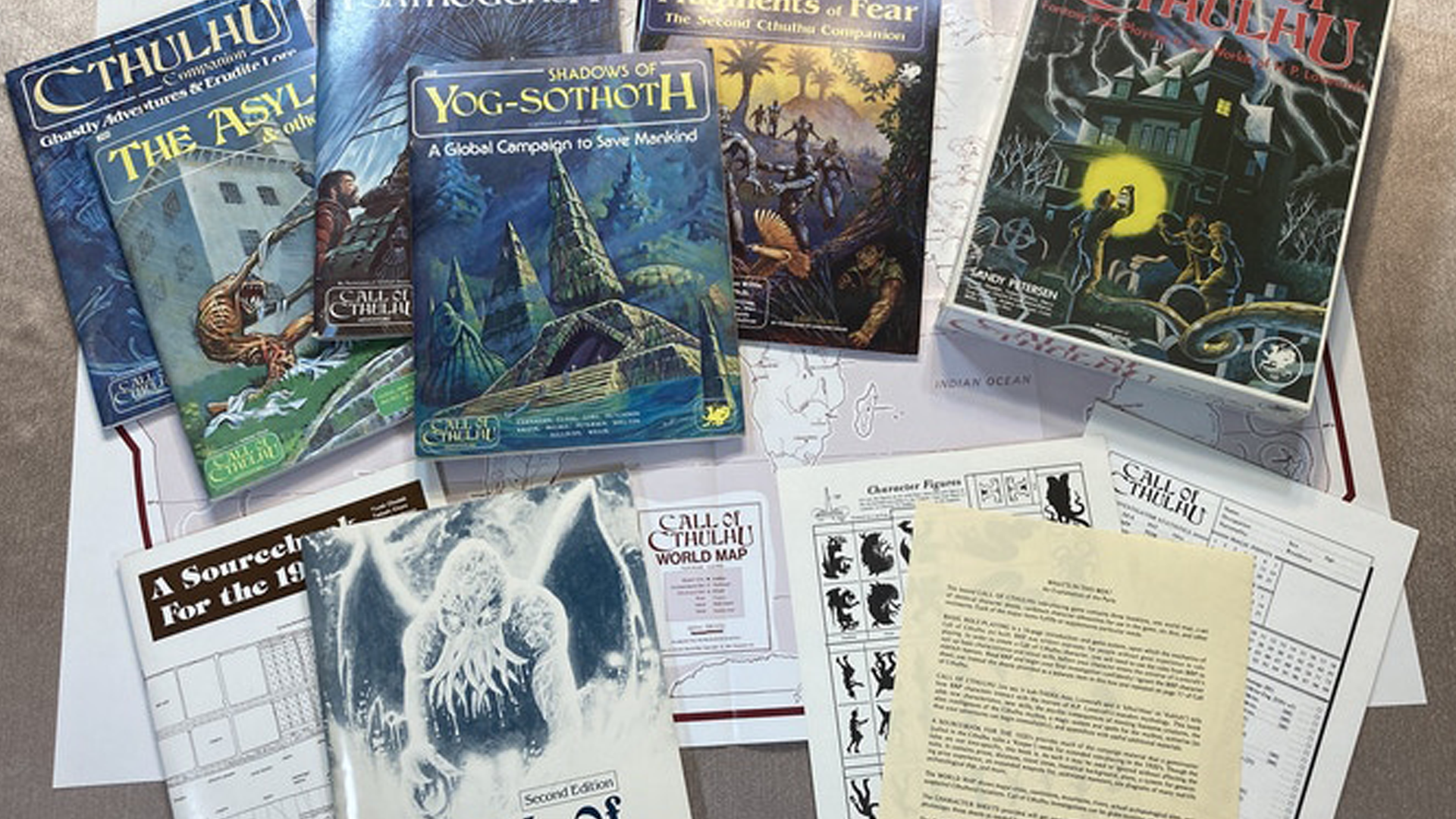 An image of the contents of the boxed edition of Call of Cthulhu Classic