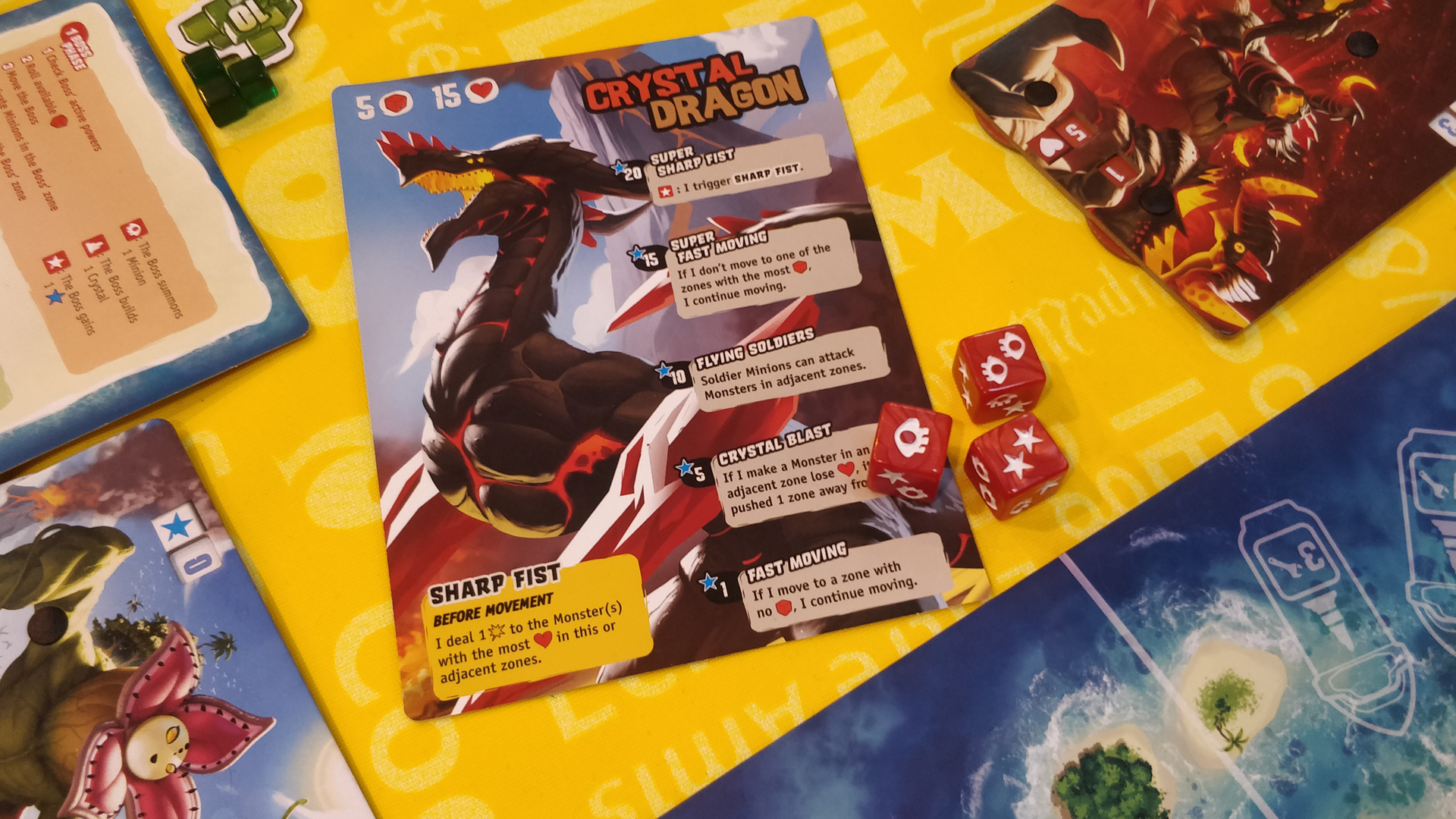 An image of the boss card and dice from King of Monster Island
