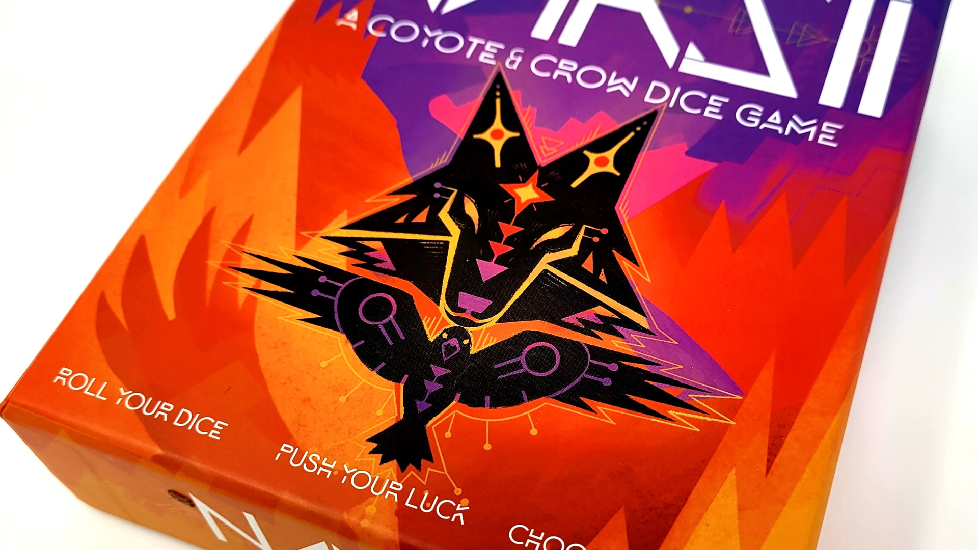 Box art of Naasii: A Coyote & Crow dice game.