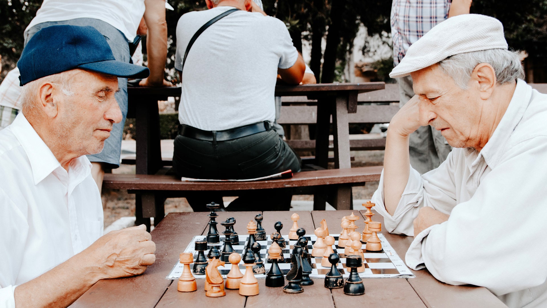 Two elderly men playing chess